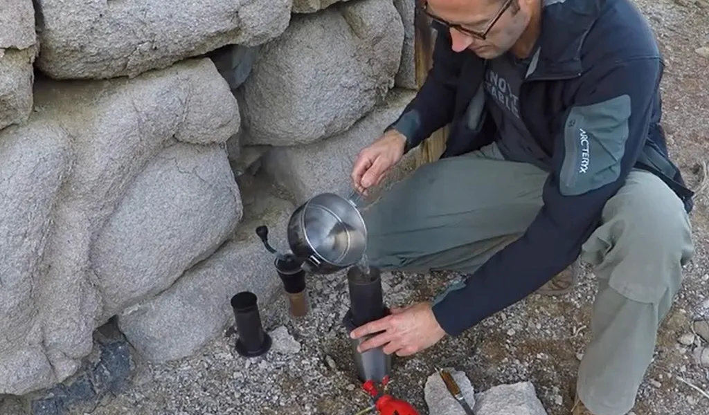 person using Aeropress espresso maker